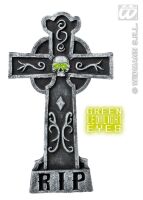 Grafsteen kruis met doodshoofd met groen verlichten ogen Grafsteen kruis met doodshoofd met groen verlichten ogen