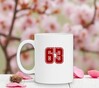 foto 3 Mok wit met getal 63 opdruk